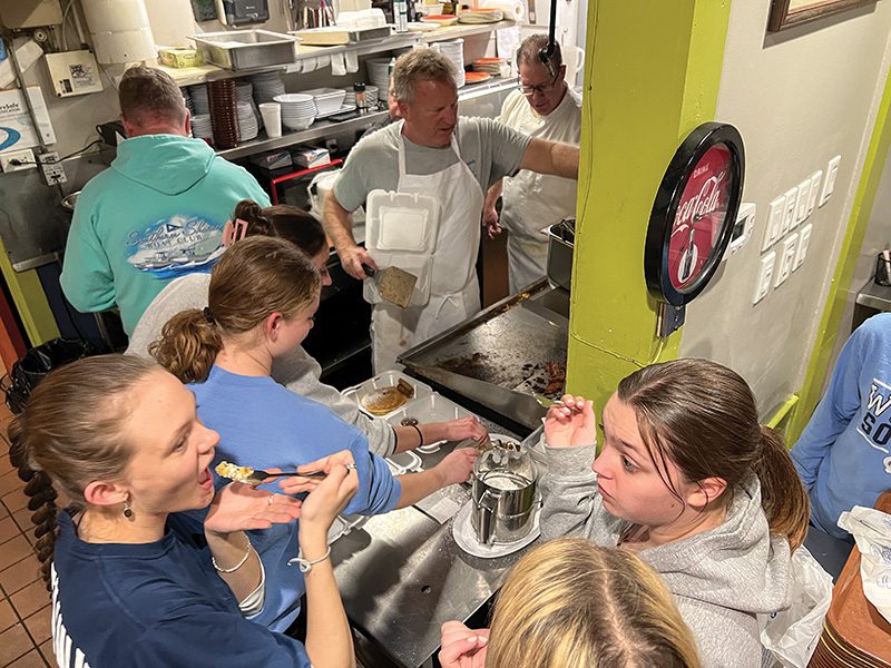 National Honor Society students from First Flight High School get a special treat from the kitchen while helping at a 2024 fundraiser. Money raised by NHS students the last three years has gone back to area elementary schools for the group’s annual service project. Photo by: Steve Hanf