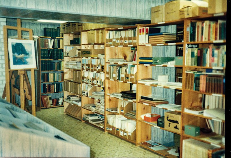 Interior of the David Stick Library at his home in Southern Shores in 1986 prior to its preparation to be transferred to the State Archives in Raleigh to await the construction of the Outer Banks History Center. Image courtesy of Leisa Greathouse, AV.5000, Discrete Audiovisual Items, Outer Banks History Center.