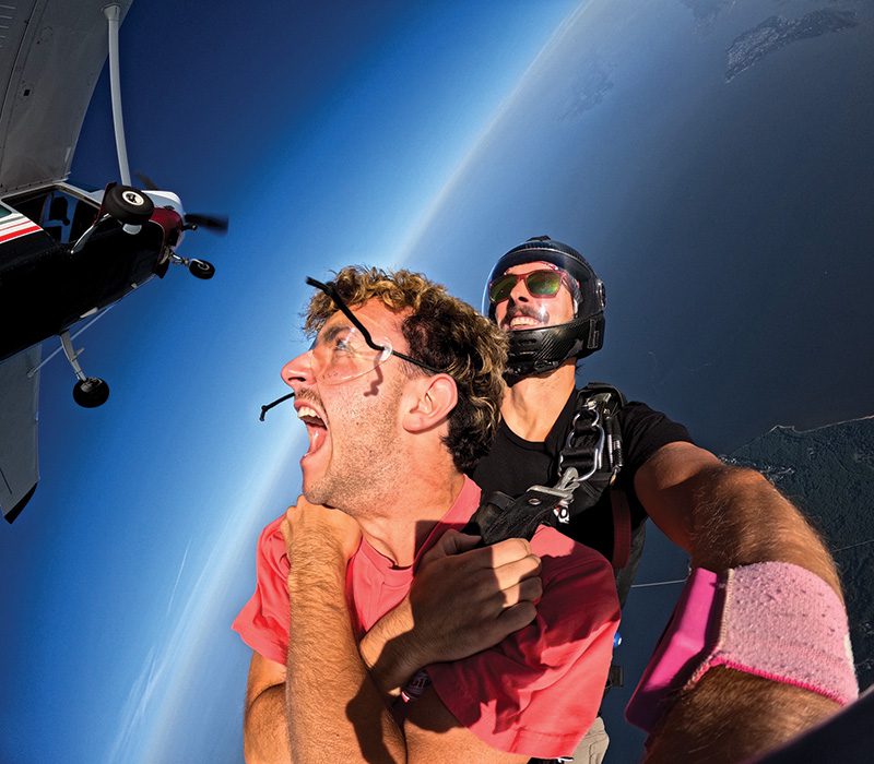 A very animated Mario Pardo, a J-1 student from Spain, who was fortunate enough to go skydiving with some of his co-workers this past summer. Mario was employed by Kitty Hawk Kite’s and Jockey’s Ridge Creamery. Photo courtesy of Skydive, OBX.