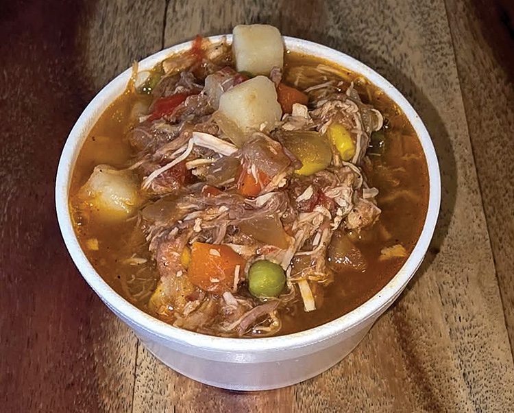 Pigman's Brunswick Stew is a hearty, slow-cooked Southern dish featuring a combination of meats, vegetables, and savory barbecue flavors. Photo by Corey Connors.