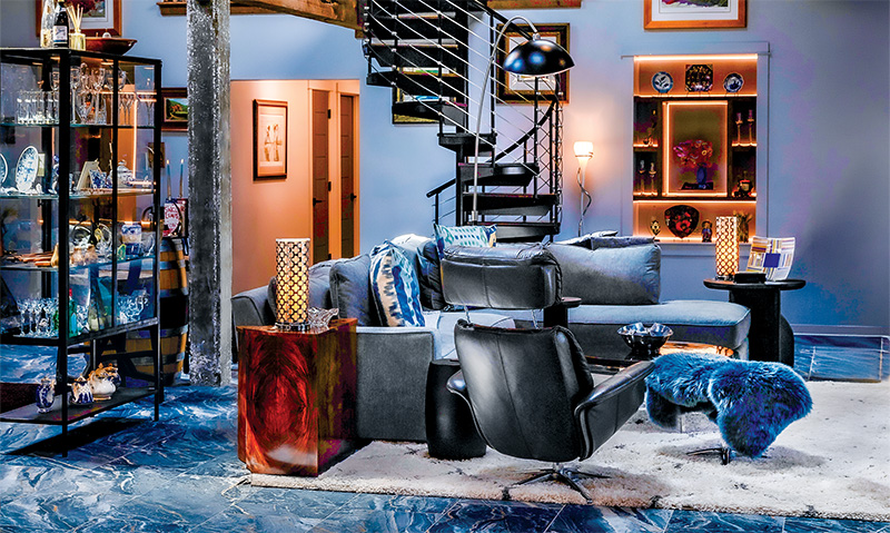 Contemporary spiral stairs—rather than a fireman’s pole—connect Kaiser's loft office to the home's main living space. Contemporary spiral stairs—rather than a fireman’s pole—connect Kaiser's loft office to the home's main living space.