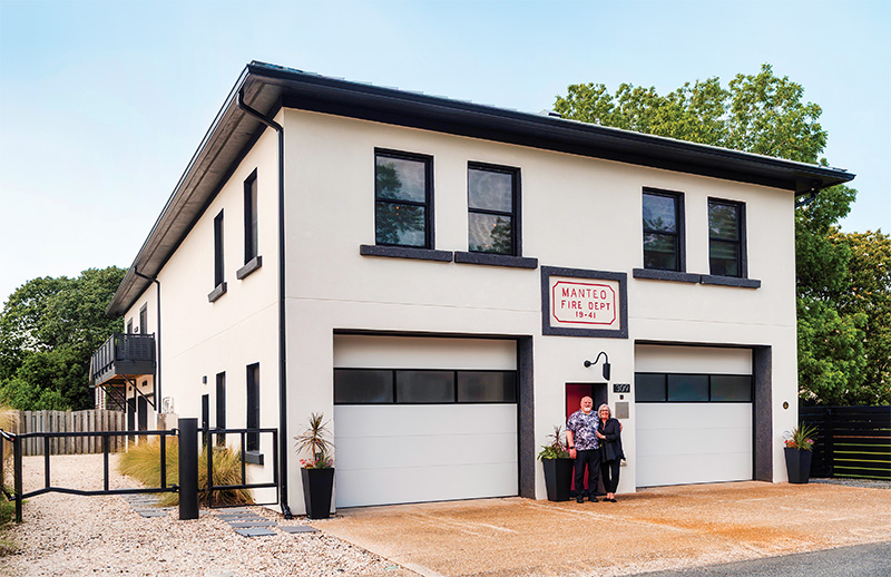 Brenda Shore and Dave Kaiser in front of their renovated 1941, WPA-era firehouse in Manteo.