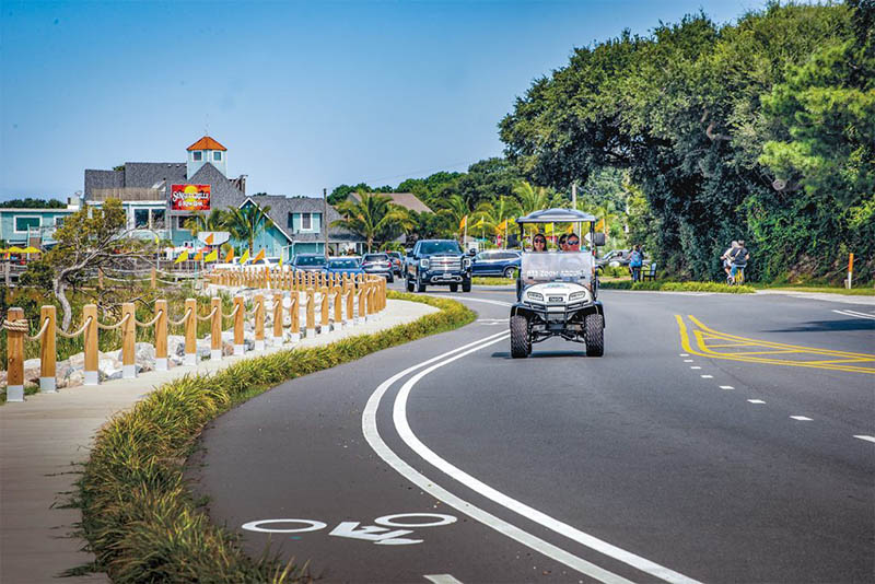 ZoomAround Golf Carts makes vacations easy, conveniently delivering a stylish cart to this Outer Banks rental, so guests can arrive, relax, and start cruising the coast hassle-free. Photo by David Uhrin.