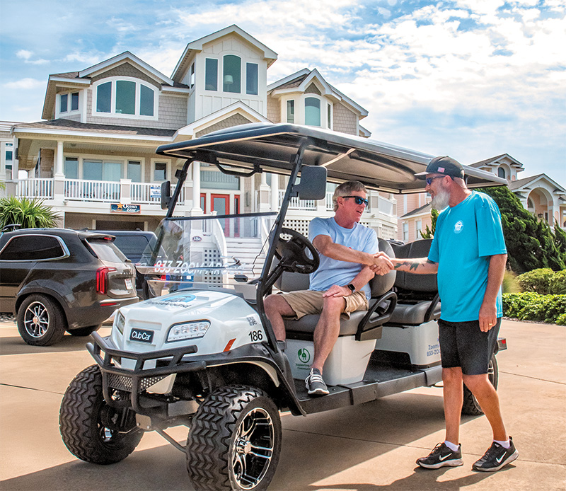 ZoomAround Golf Carts helps make every beach day easier, giving families an effortless way to carry their gear and enjoy the Outer Banks from driveway to shoreline without the hassle of driving their own vehicle. Photo by David Uhrin.