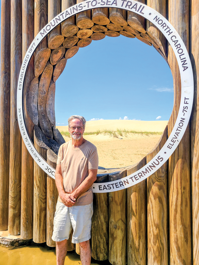 Few can resist a photo opp at the iconic marker indicating the eastern terminus of North Carolina's 1,175-mile Mountains-to-Sea Trail.