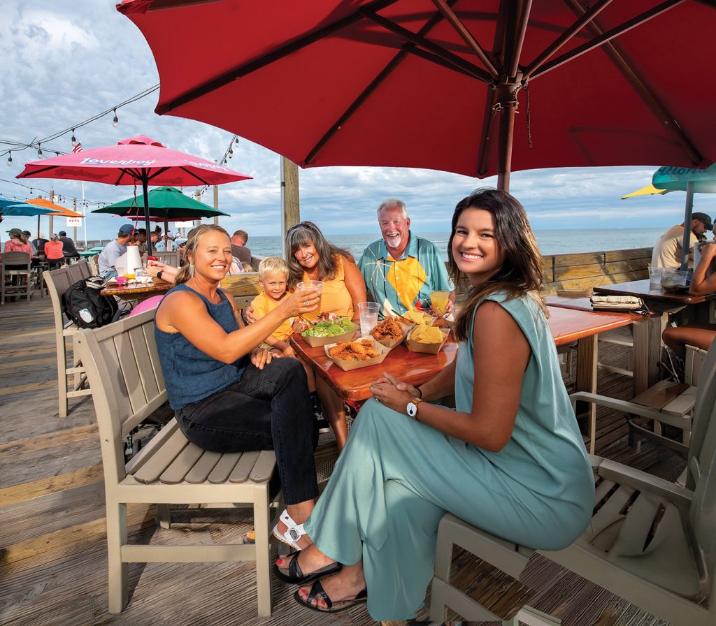 Perched above the Atlantic on the Outer Banks Fishing Pier, Fish Heads Bar & Grill in Nags Head offers one of the Outer Banks’ most distinctive outdoor dining experiences, with fresh seafood and unparalleled ocean views from tables set directly over the water.